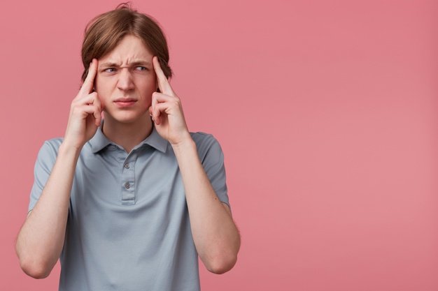 close-up-young-man-thinking-trying-hard-remember-something-looking-focused-rightside-blank-copyspace-fingers-temples-isolated-pink-background-negative-emotion-facial-express