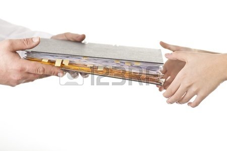 8911048-male-give-file-folder-of-paperwork-to-another-person