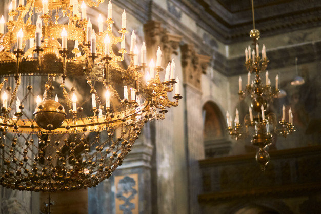 golden-chandelier-hangs-from-ceiling-church_8353-8658